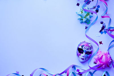 High angle view of purple candies against blue background