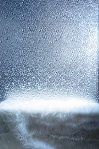Full frame shot of sea seen through glass