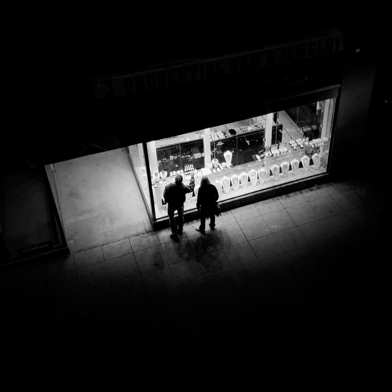 SILHOUETTE PEOPLE IN CORRIDOR