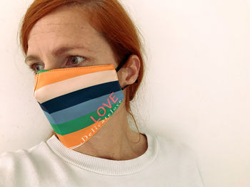 Portrait of woman against white background