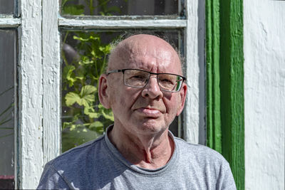 Portrait of man wearing eyeglasses