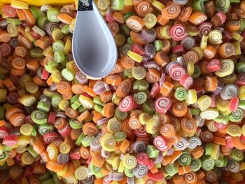 High angle view of multi colored candies on table