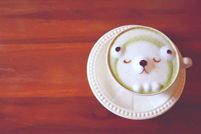 Directly above shot of coffee cup on table