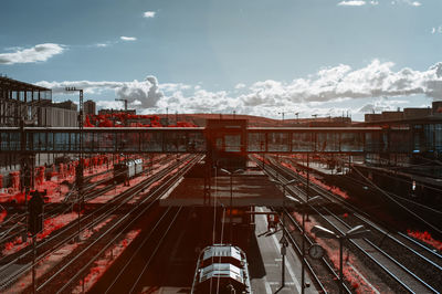 Train at railroad station against sky