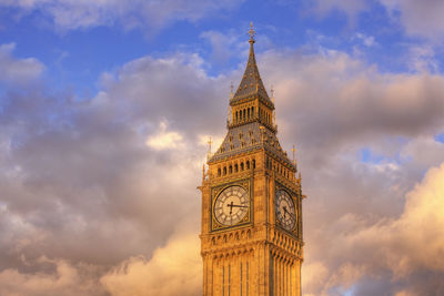Low angle view of clock tower against sky