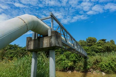 Low angle view of bridge against blue sky