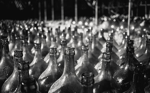 Close-up of bottles in row