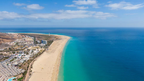 High angle view of sea against blue sky