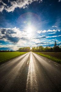 Road on field against sky