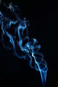 Close-up of smoke against black background