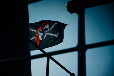 Low angle view of flag against sky