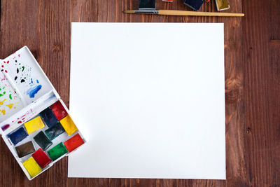 High angle view of multi colored paper on table