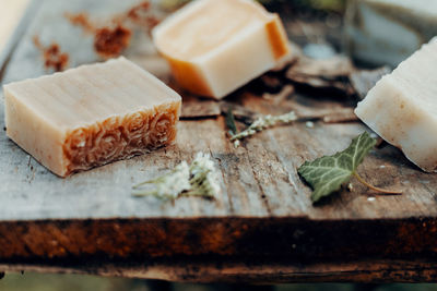 Making handmade natural soaps on an old wooden table