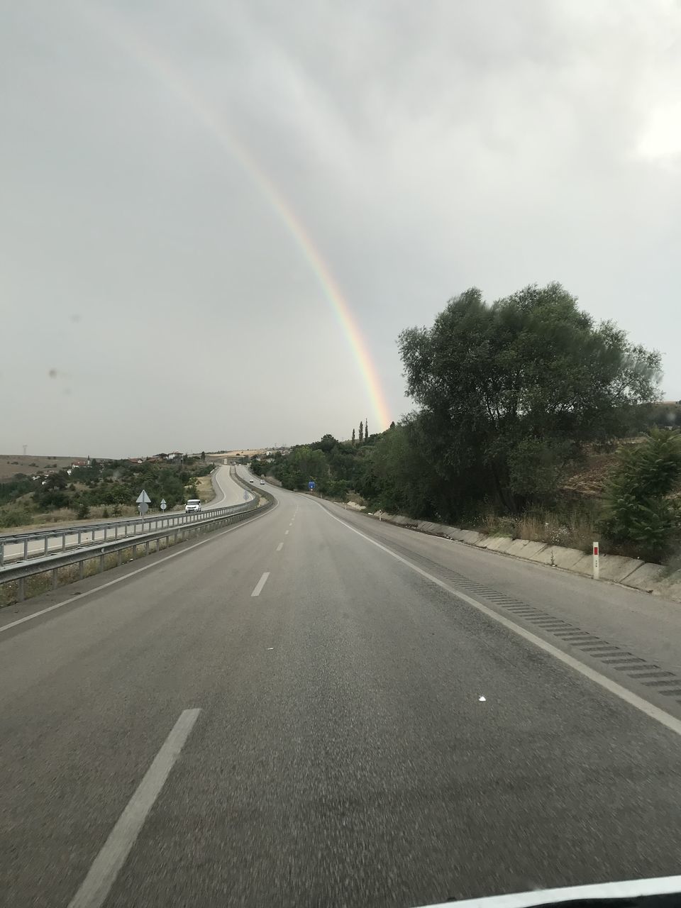 VIEW OF RAINBOW OVER ROAD