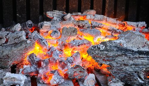 High angle view of fire on wood