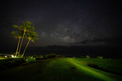 Scenic view of field against sky at night