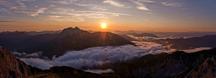 Scenic view of mountains against sky during sunset