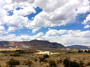 Scenic view of landscape against cloudy sky