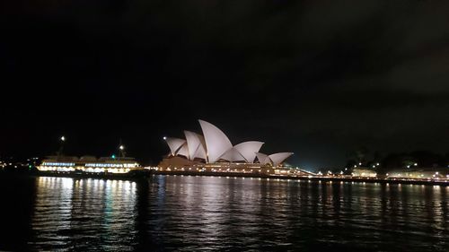 View of illuminated city buildings at night