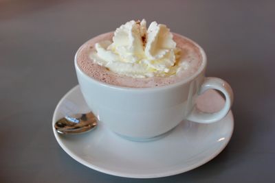 High angle view of fresh whipped cream in hot chocolate on table