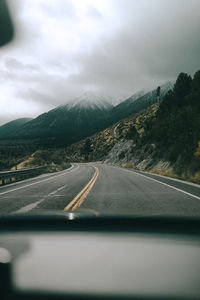 Road seen through car windshield