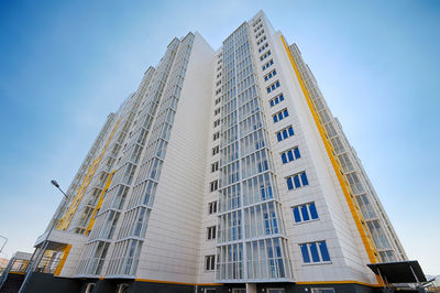 Low angle view of modern buildings against clear sky