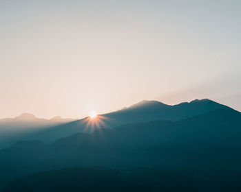 Scenic view of mountains against sky during sunset