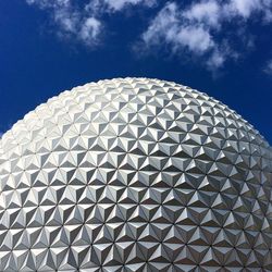 Low angle view of modern building against blue sky