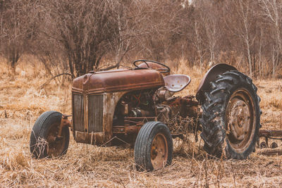 Close-up of abandoned tire on field