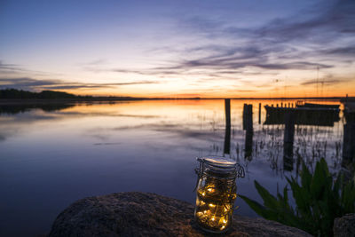 Scenic view of lake against sky during sunset