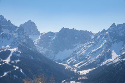 Idyllic kronplatz mountain range against clear blue sky in winter