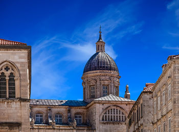 View of buildings against blue sky