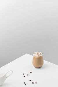 Close-up of coffee on table against white background