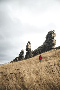 Rock formations on land against sky