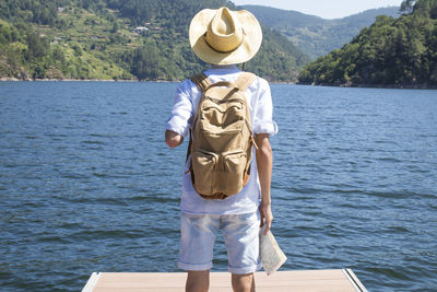 Traveller with the backpack at the jetty