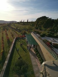 High angle view of people on landscape against sky