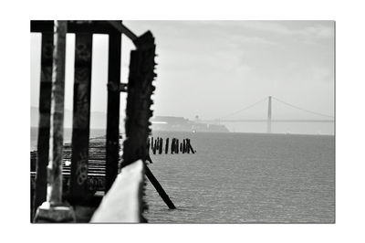 Bridge over sea against sky