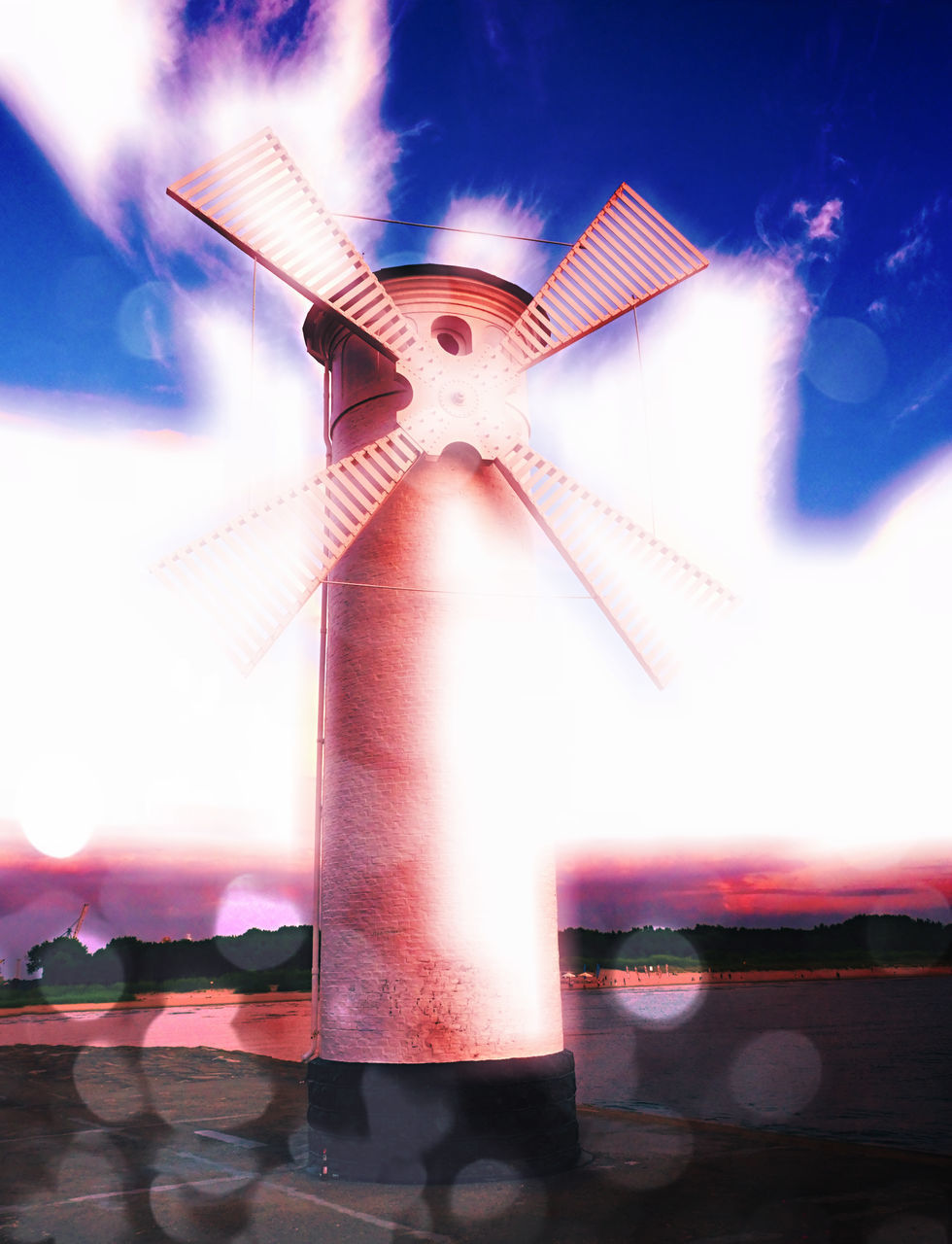 LOW ANGLE VIEW OF WINDMILLS AGAINST SKY