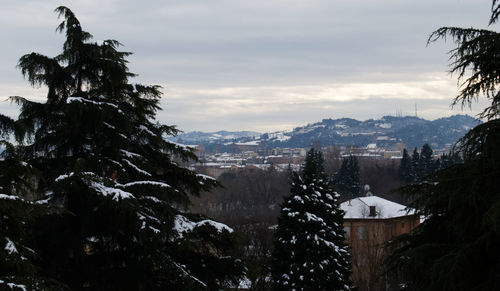 Aerial view of townscape against sky during winter