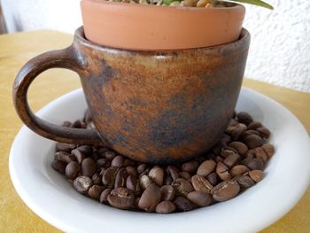 Close-up of coffee beans on table