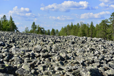 Rocks on land against sky