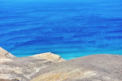 High angle view of beach against blue sky