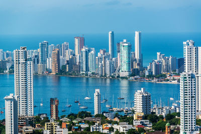 View of cityscape against blue sky