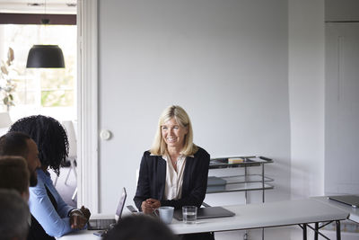 Smiling businesswoman at meeting