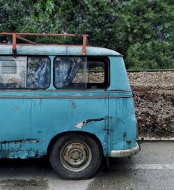 Abandoned vintage car on road