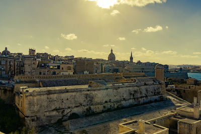 View of buildings in city against sky