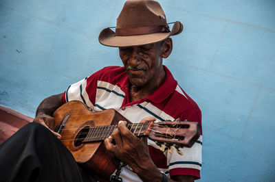 Man playing guitar at music concert