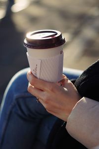 Cropped hand holding coffee
