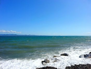 Scenic view of sea against clear sky