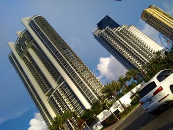 Low angle view of modern buildings against sky in city